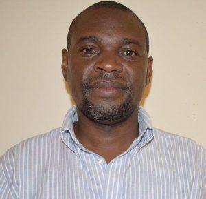 Headshot of Dr. Dickens Onyango.