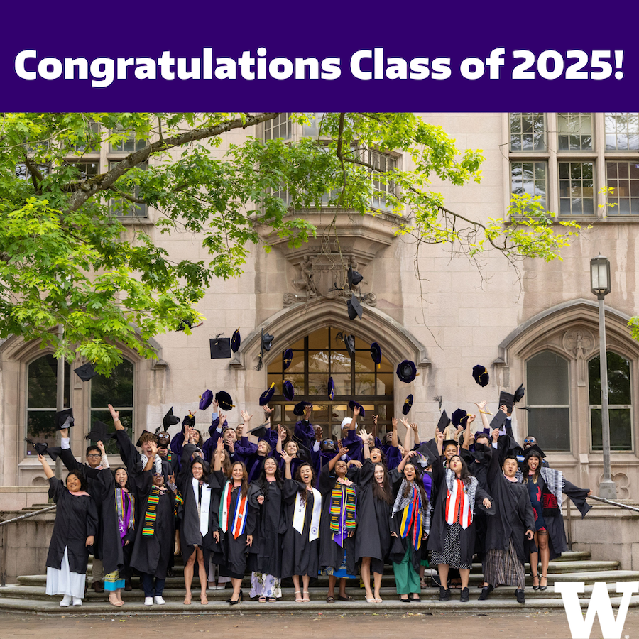 Group shot of the DGH Graduates wearing graduation gowns and throwing their hats up into the air, while standing on the steps of an ornate UW buidling.