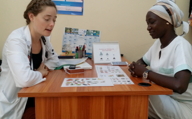 Photo of Sylvia counseling a social worker in Senegal